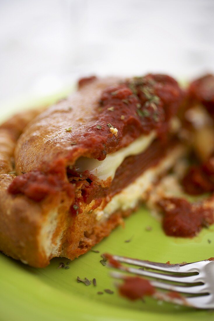 Close Up of Sliced Pepperoni and Mozzarella Cheese Calzone