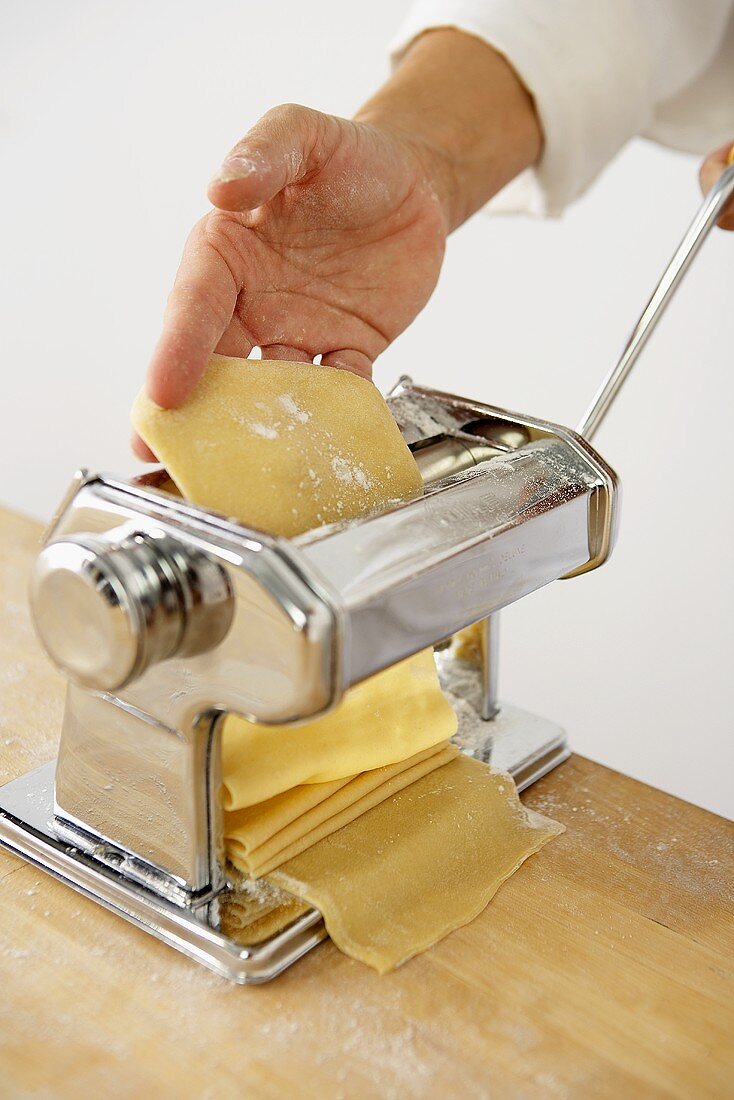 Making Pasta: Passing Sheet of Pasta Through a Pasta Maker