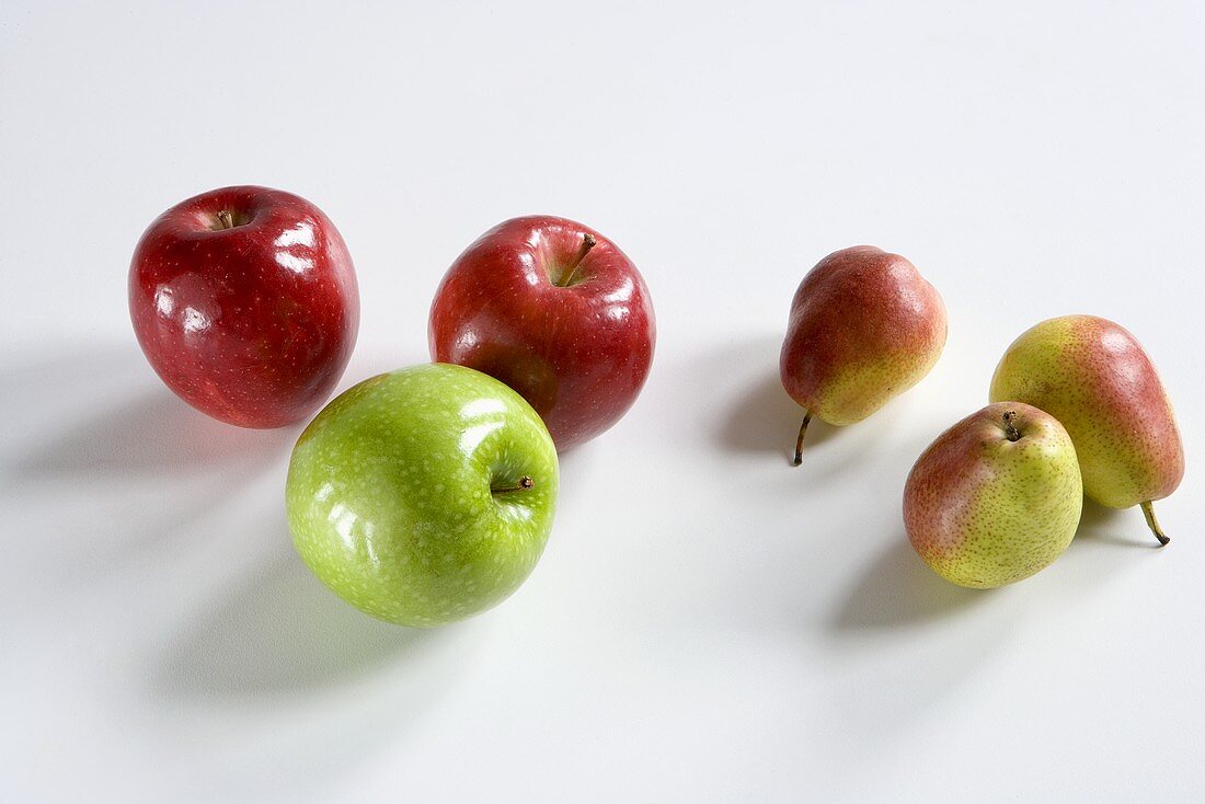 Assorted Apples and Pears on a White Background