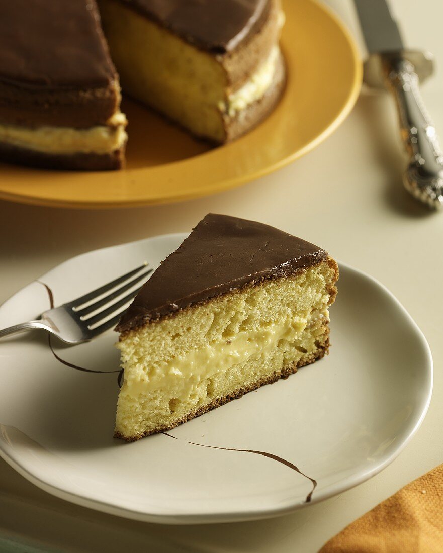 Slice of Boston Cream Pie on a Plate with Fork