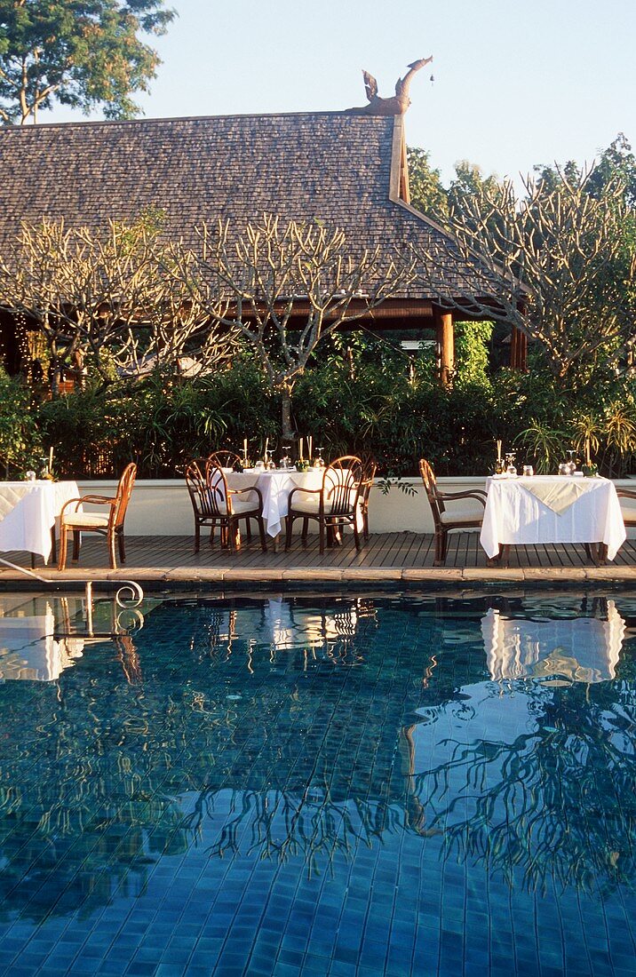 Tables Set Up Poolside at the Four Seasons Hotel in Chiang Mai, Thailand