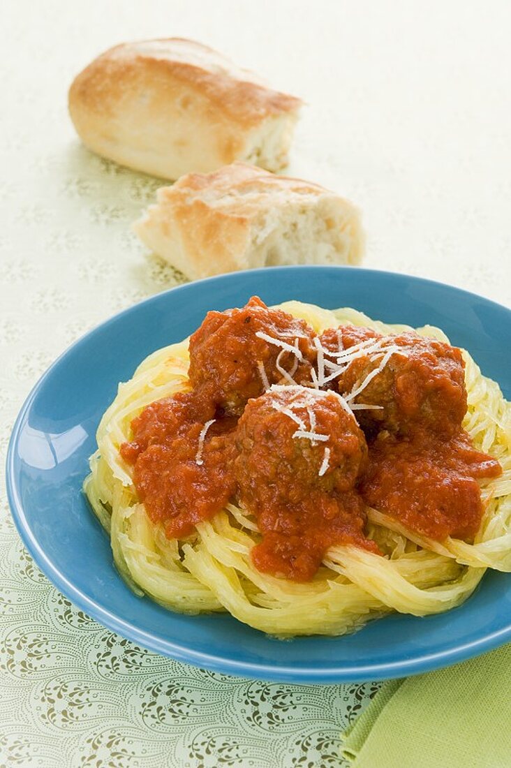 Meatballs and Tomato Sauce Served Over Spaghetti Squash, Bread