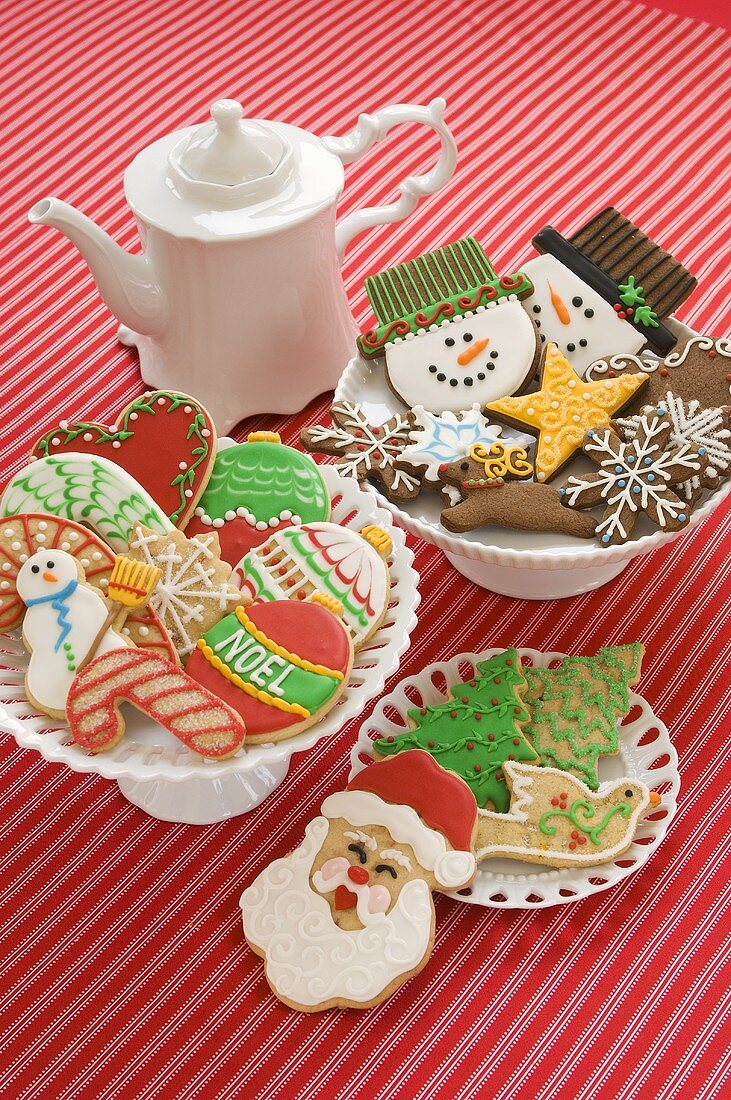Many Assorted Christmas Cookies in White Bowls, Tea Pot