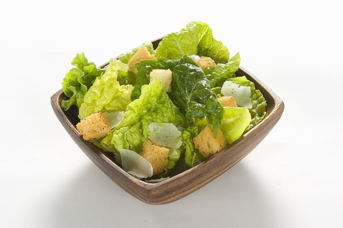 Caesar Salad in a Square Bowl on a White Background
