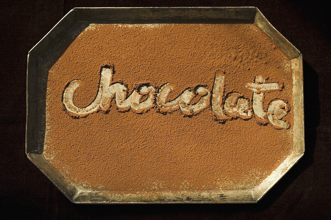 The Word Chocolate Written in Cocoa Powder, From Above