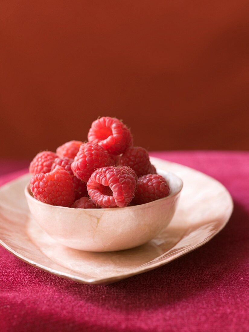 Raspberries in a small bowl