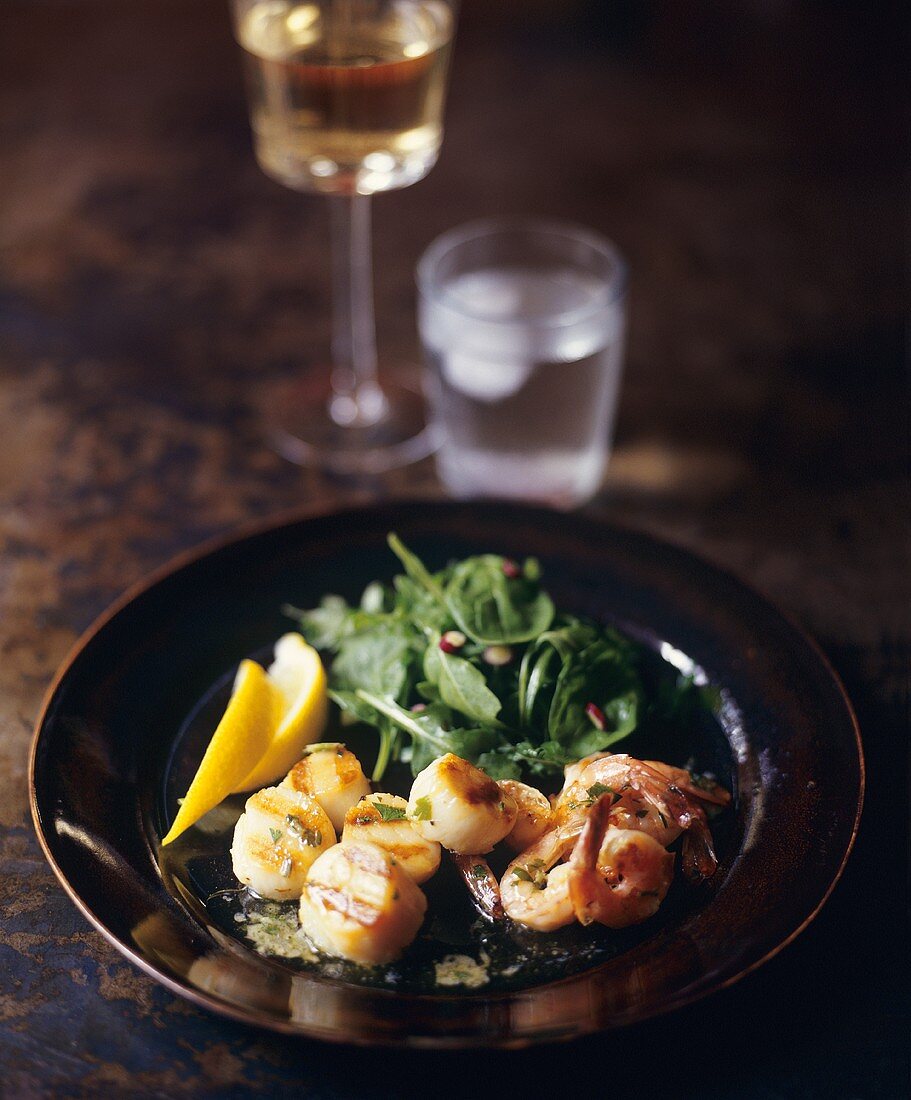 Scallops and Shrimp with Rocket Salad; Glass of Water and Wine