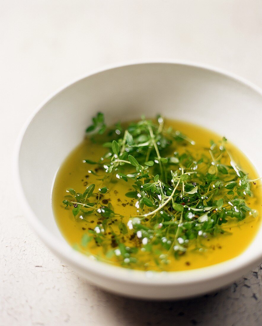 Olive Oil with Fresh Thyme in a Bowl
