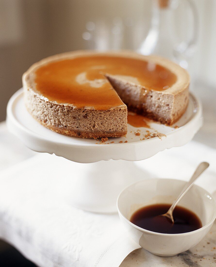 Hazelnut torte with caramel sauce, one slice removed