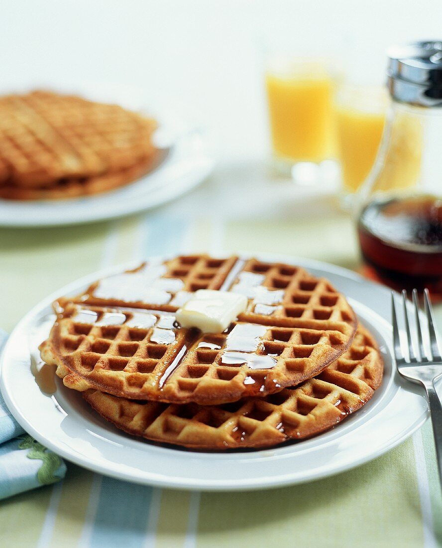 Plate of Waffles with Butter and Maple Syrup