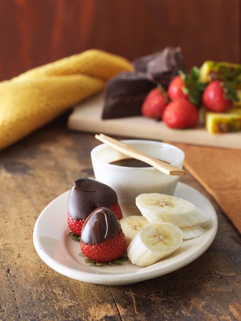 Chocolate Dipping Sauce with Dipped Strawberries and Bananas