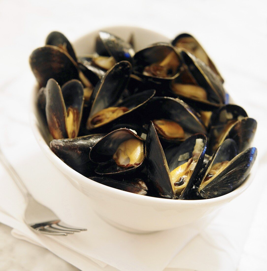 Belgium Mussels in White Wine in a Bowl; Fork