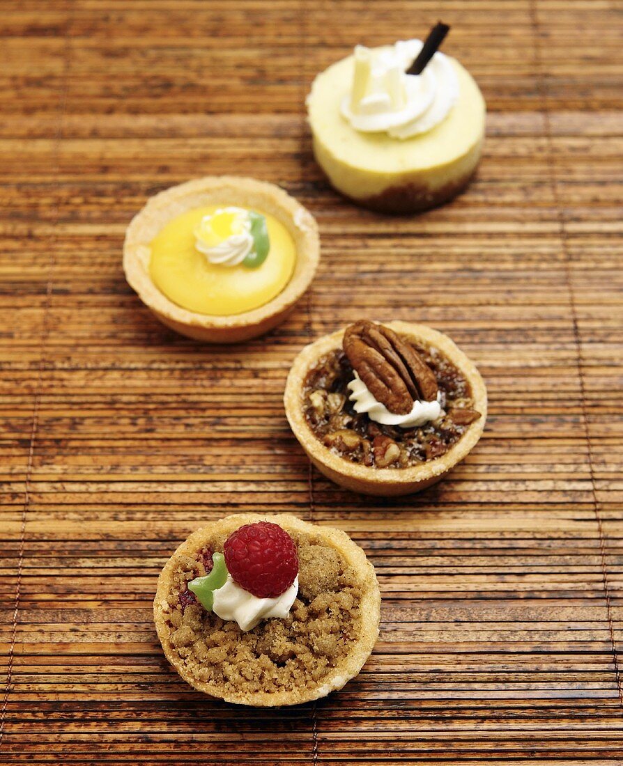 Four Assorted Mini Tarts; Raspberry Crumb, Lemon Custard, Pecan, White Chocolate Mousse