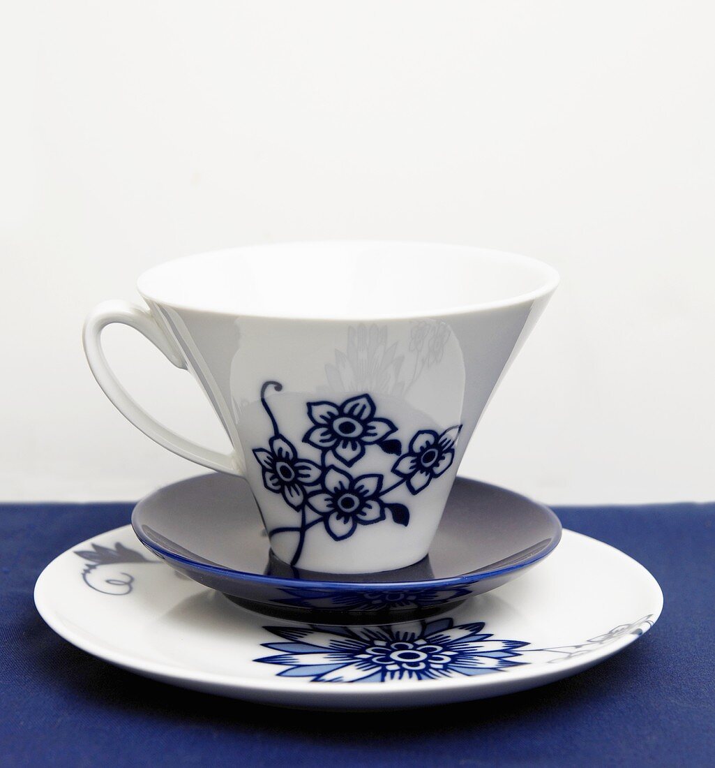 Tea Cup with Floral Design on Two Plates