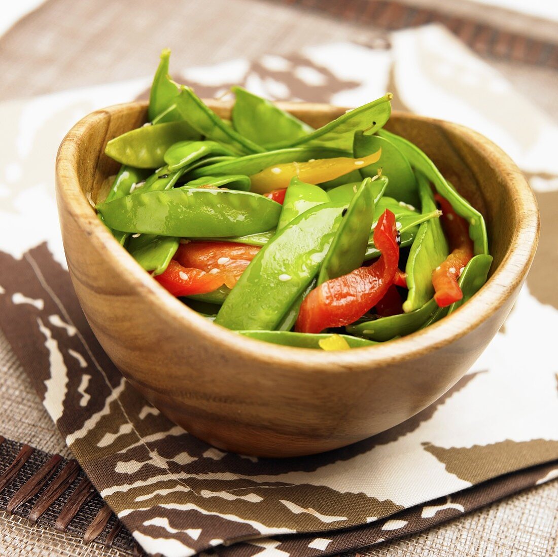 Snap Pea Salad with Red and Yellow Bell Peppers; Wooden Bowl