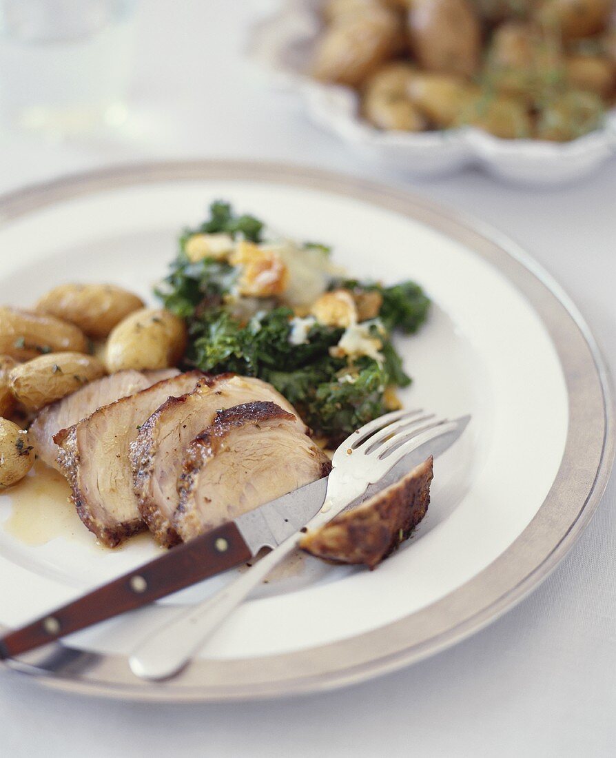 Sliced Pork Roast on a Plate with Vegetables