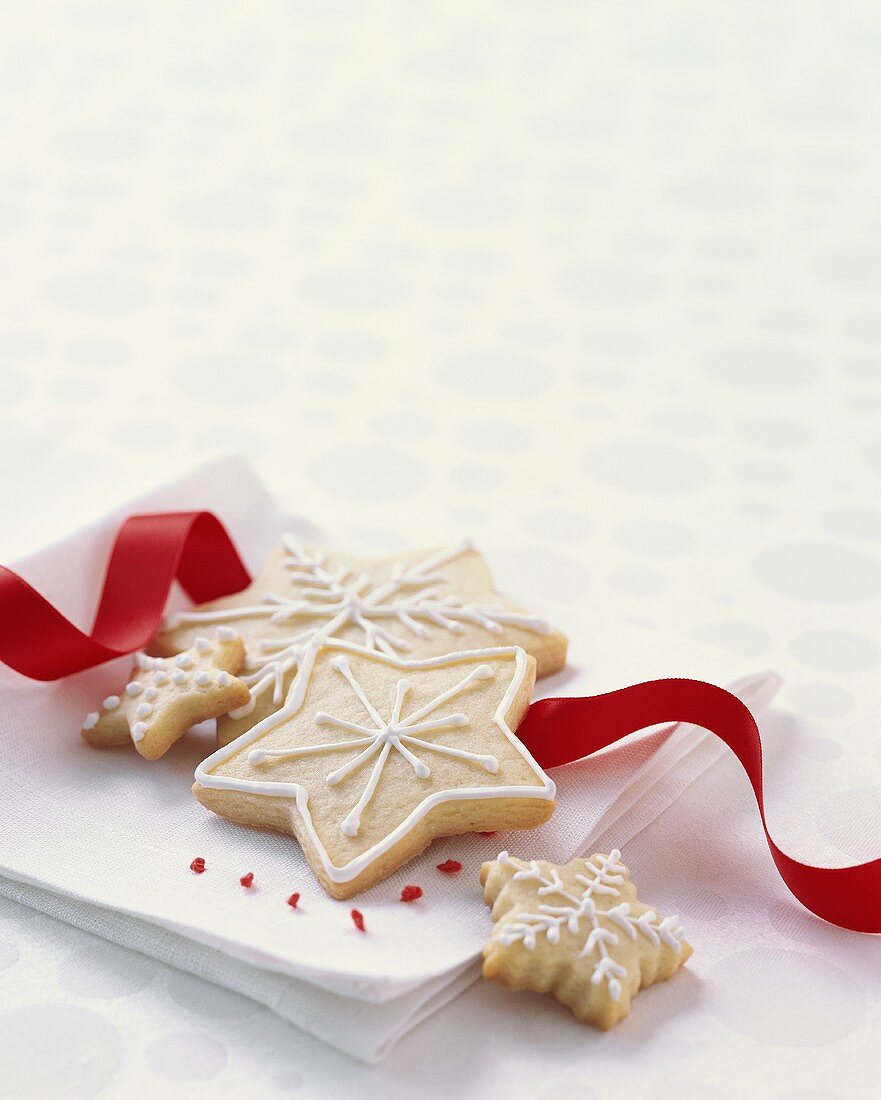 Decorated Christmas Cookies on a Napkin with Ribbon
