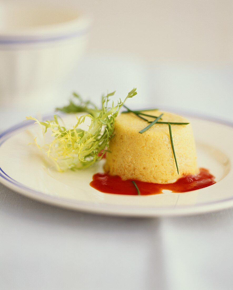 Onion Flan on Plate with Chive Garnish