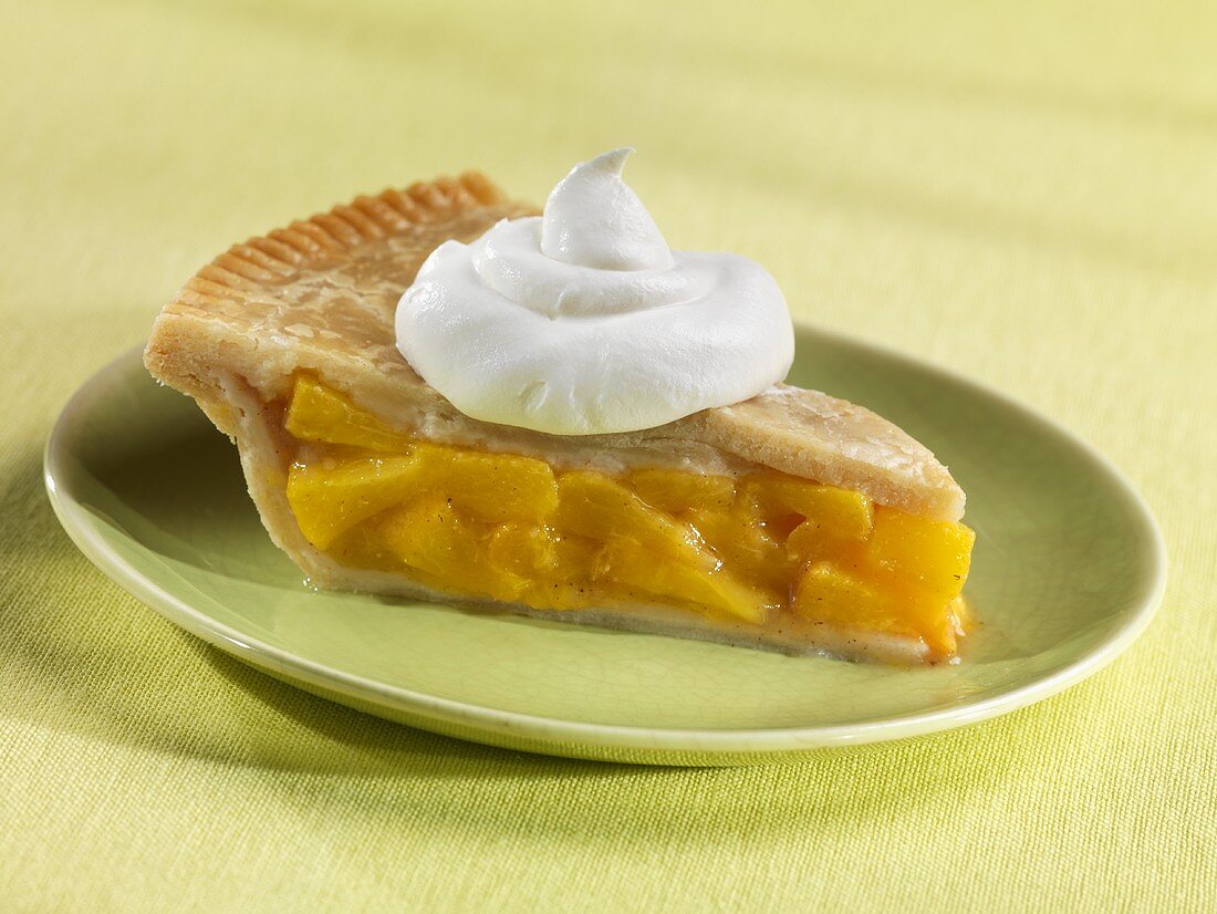 Slice of Peach Pie with a Dollop of Whipped Cream