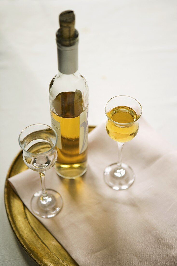 Bottle of Sauternes with Two Glass; One Full; One Empty