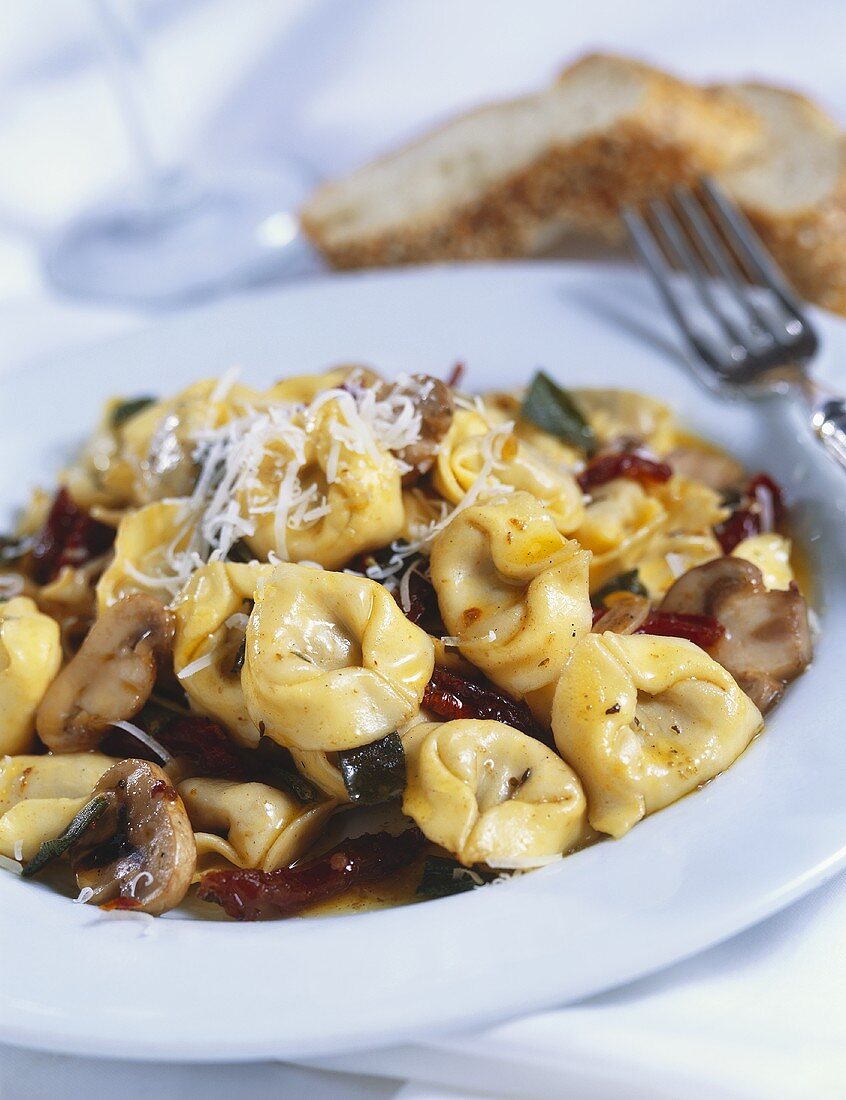 Tortellini with Mushrooms on White Dish