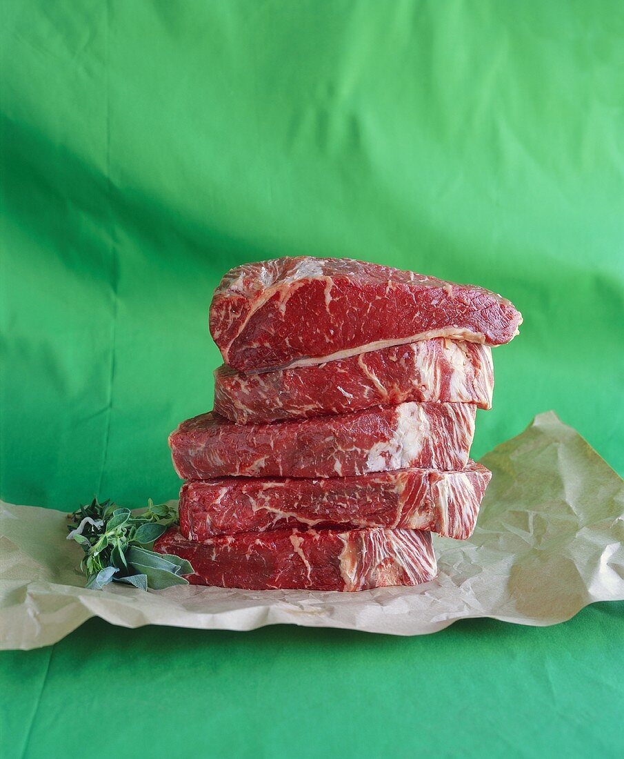 Fresh Steak Stacked on Butcher's Paper