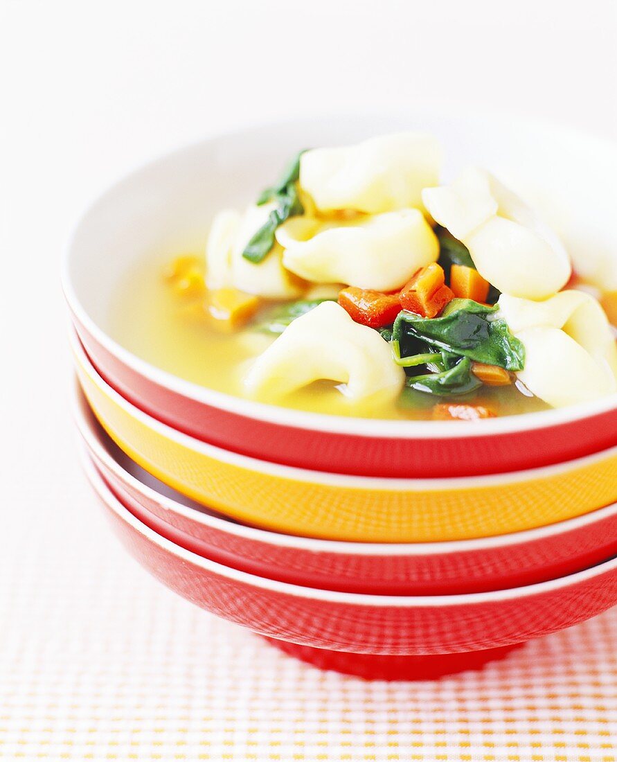 Tortellini Soup in Stacked Bowls