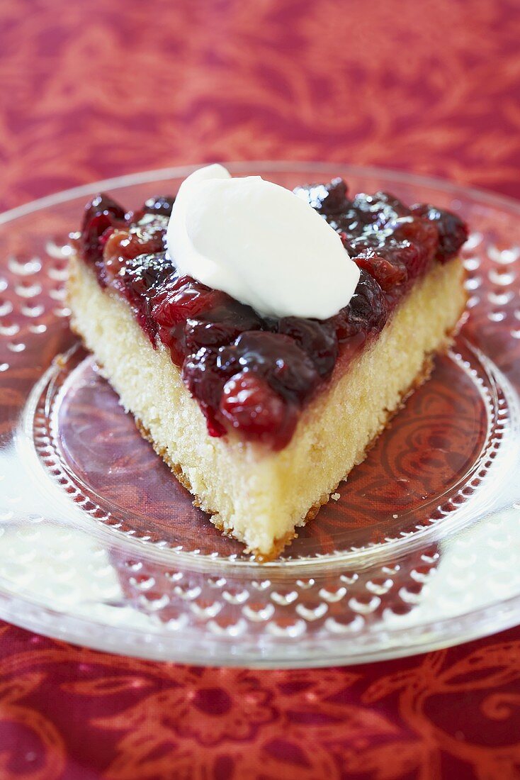 A Slice of Cranberry Cake with Whipped Cream