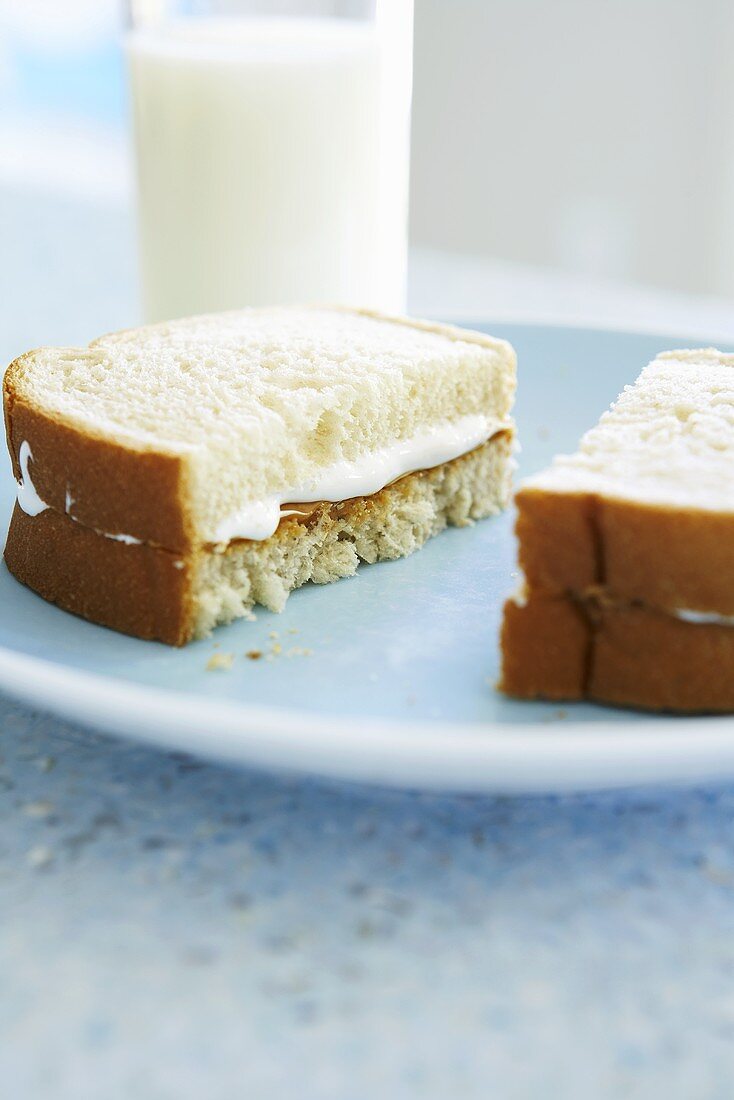 Peanut Butter and Fluff Sandwich on White Bread; With Milk