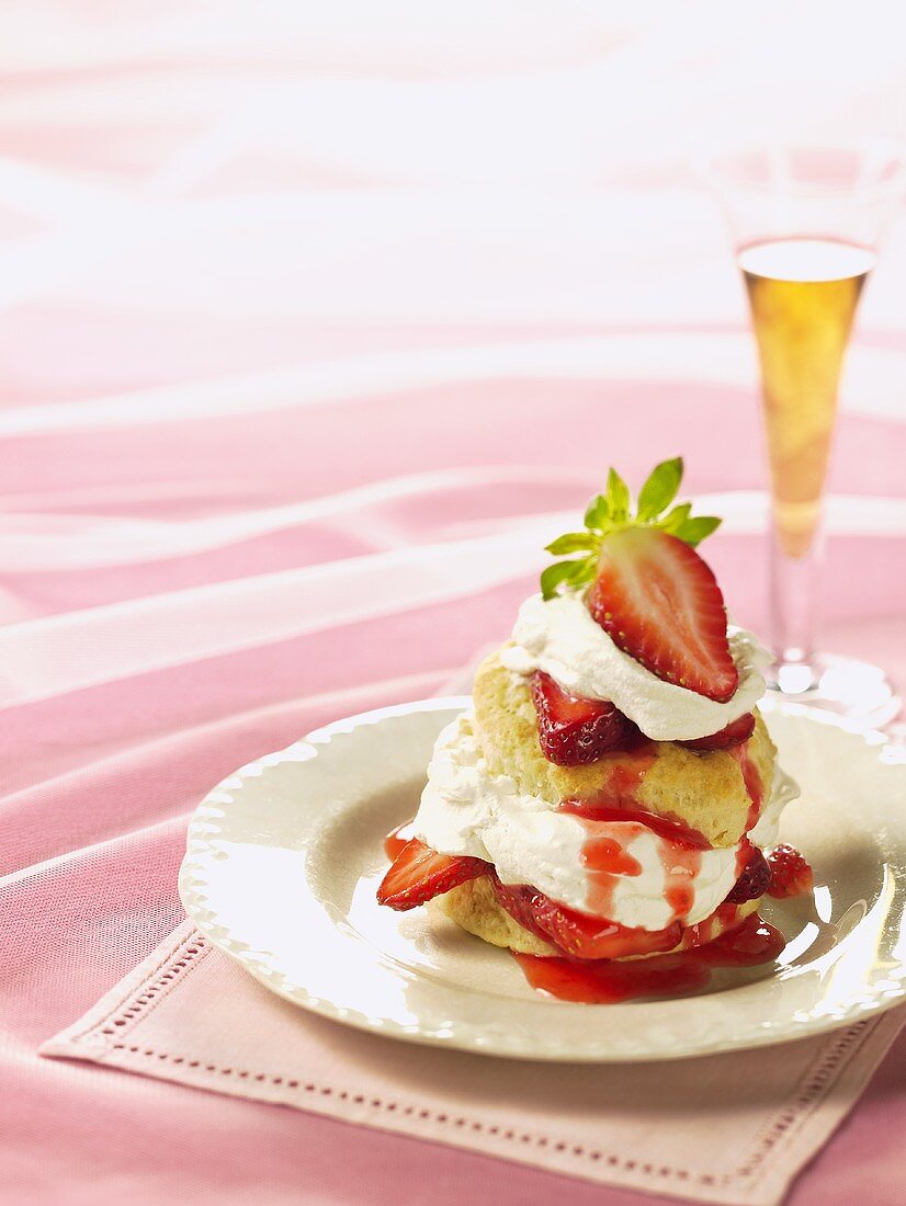 Strawberry Shortcake on White Dish; Champagne