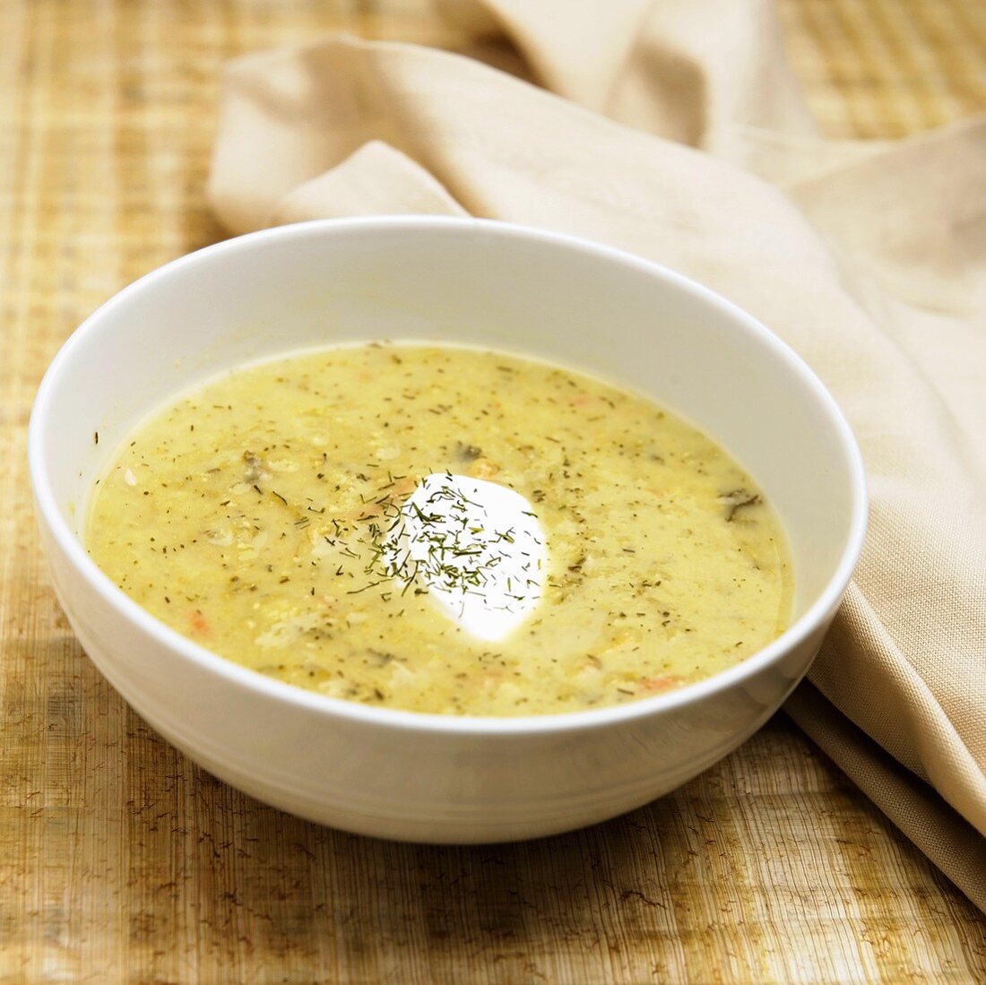 Bowl of Asparagus Soup with Sour Cream and Dill