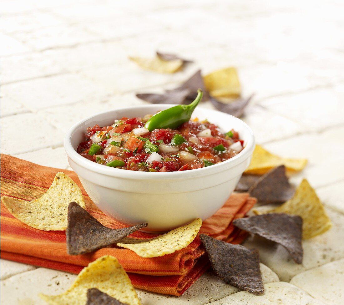 Bowl of Fresh Salsa with Blue and Yellow Corn Chips
