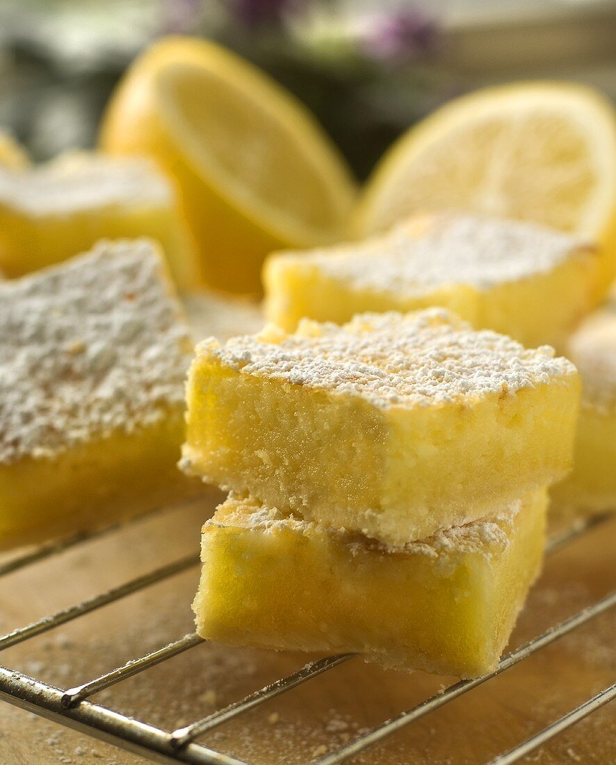 Lemon Squares Dusted with Powdered Sugar on a Rack