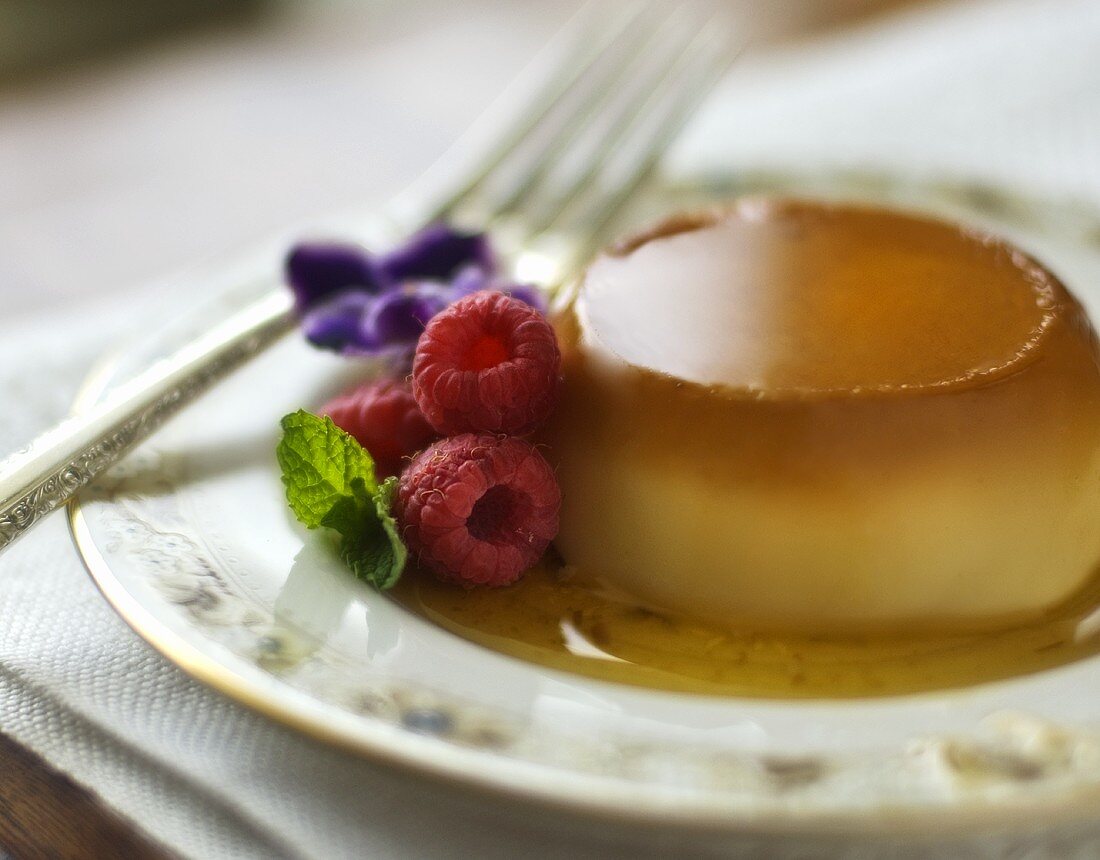 Flan with Caramel Sauce and Raspberries