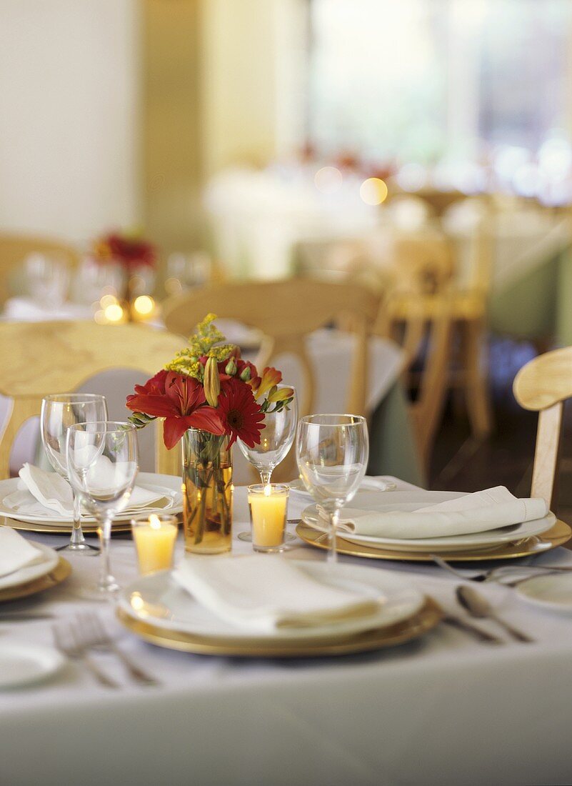 Table Set in Restaurant with Candles and Flowers