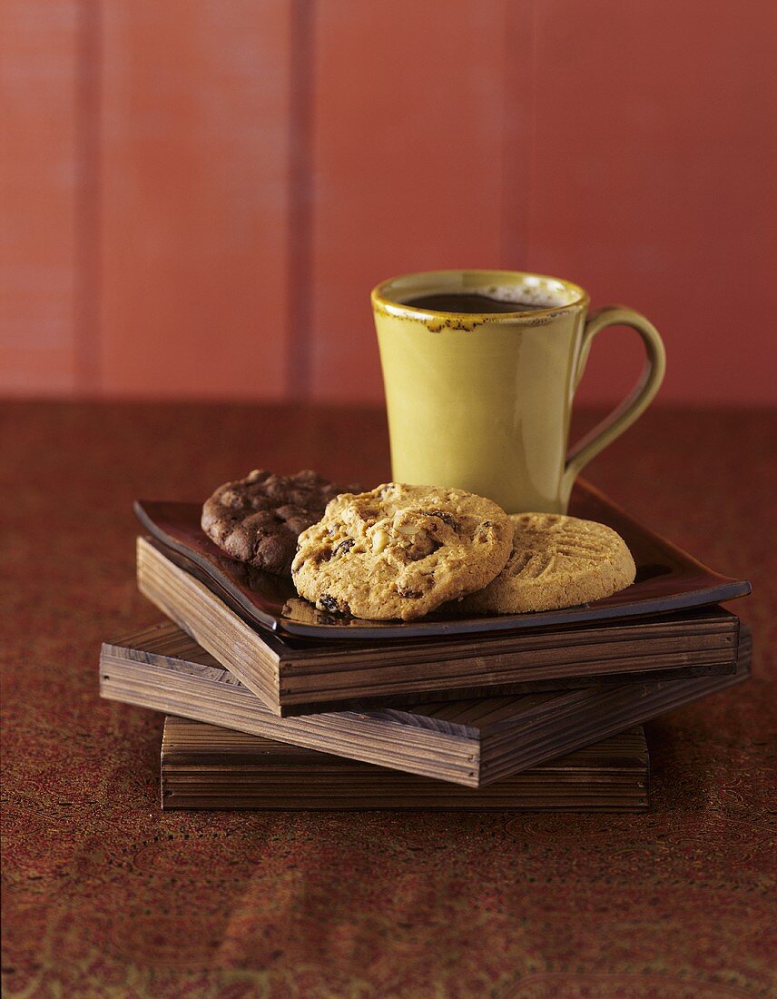 Three Assorted Cookies with a Cup of Coffee