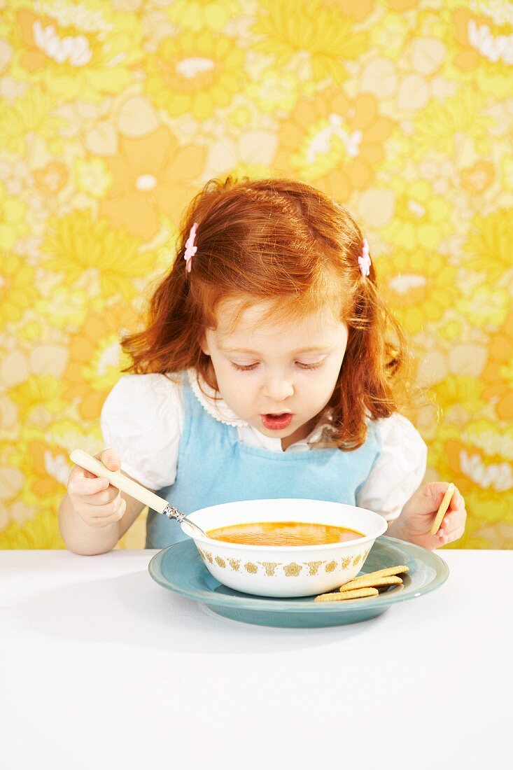Red Headed Girl Eating Tomato Soup