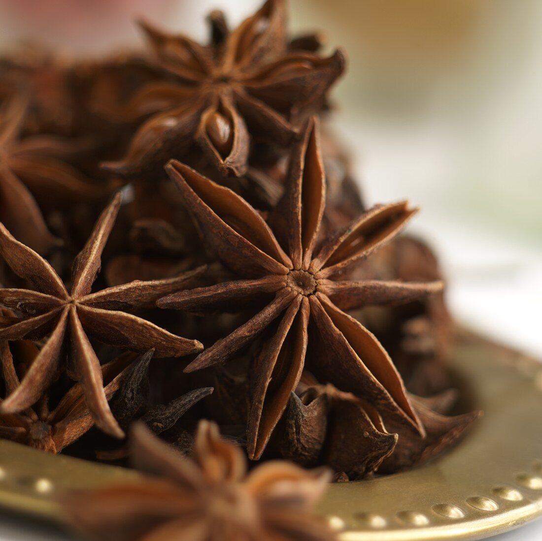 Star Anise on a Gold Plate; Close Up