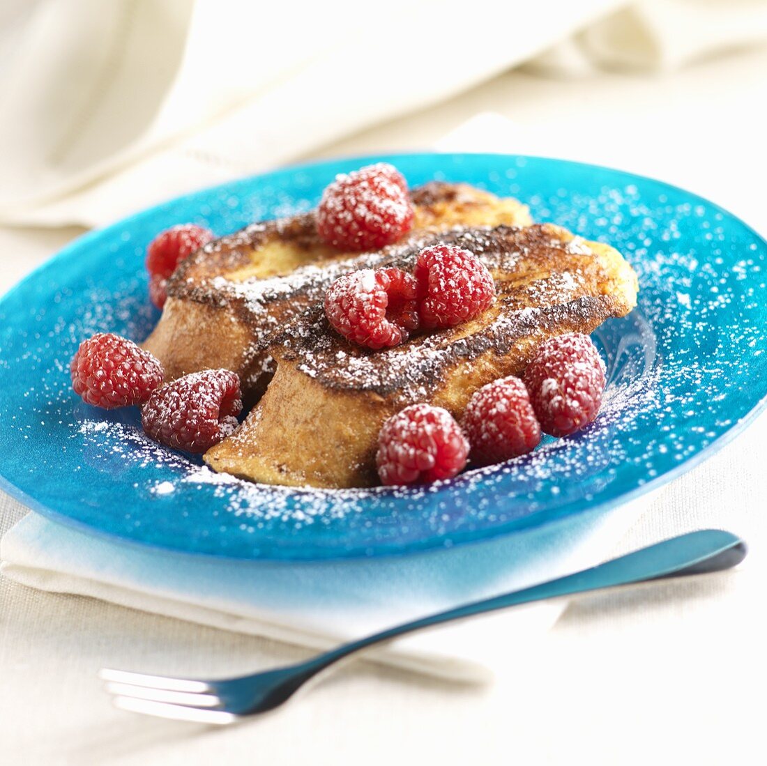 French Toast with Raspberries and Powdered Sugar