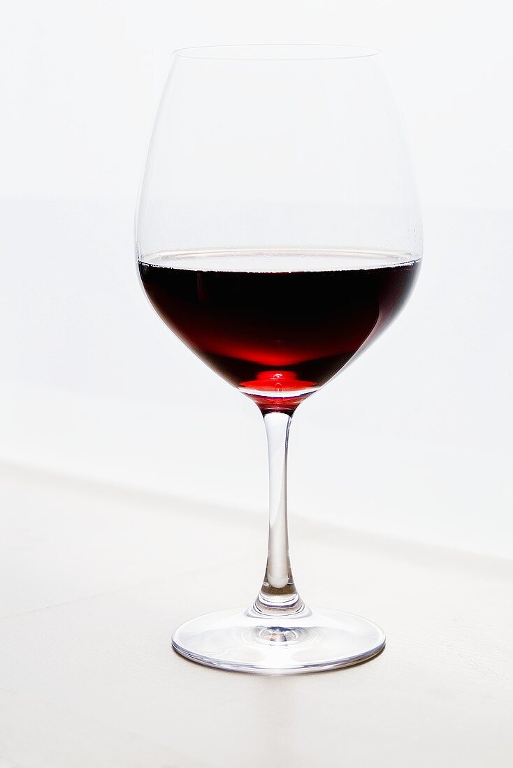 Glass of Red Wine on White