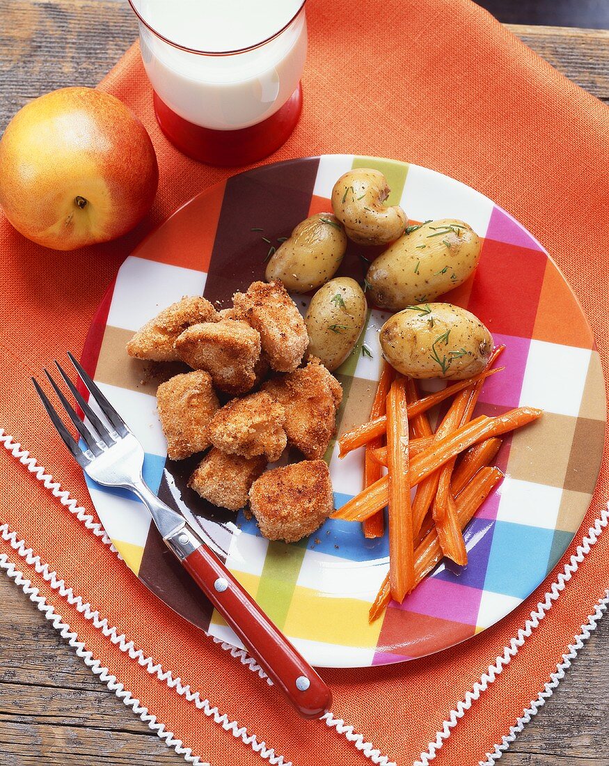 Chicken Nuggets with Roasted Potatoes and Carrot Sticks