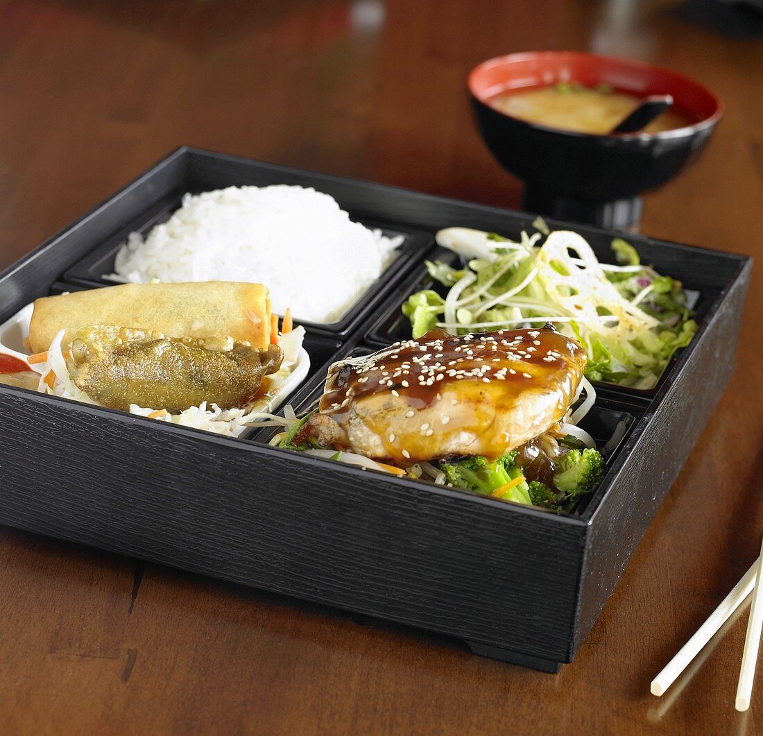 Salmon Teriyaki Bento Box with Rice, Uchi No Salad, Spinach Gyoza, Spring Roll; Miso Soup