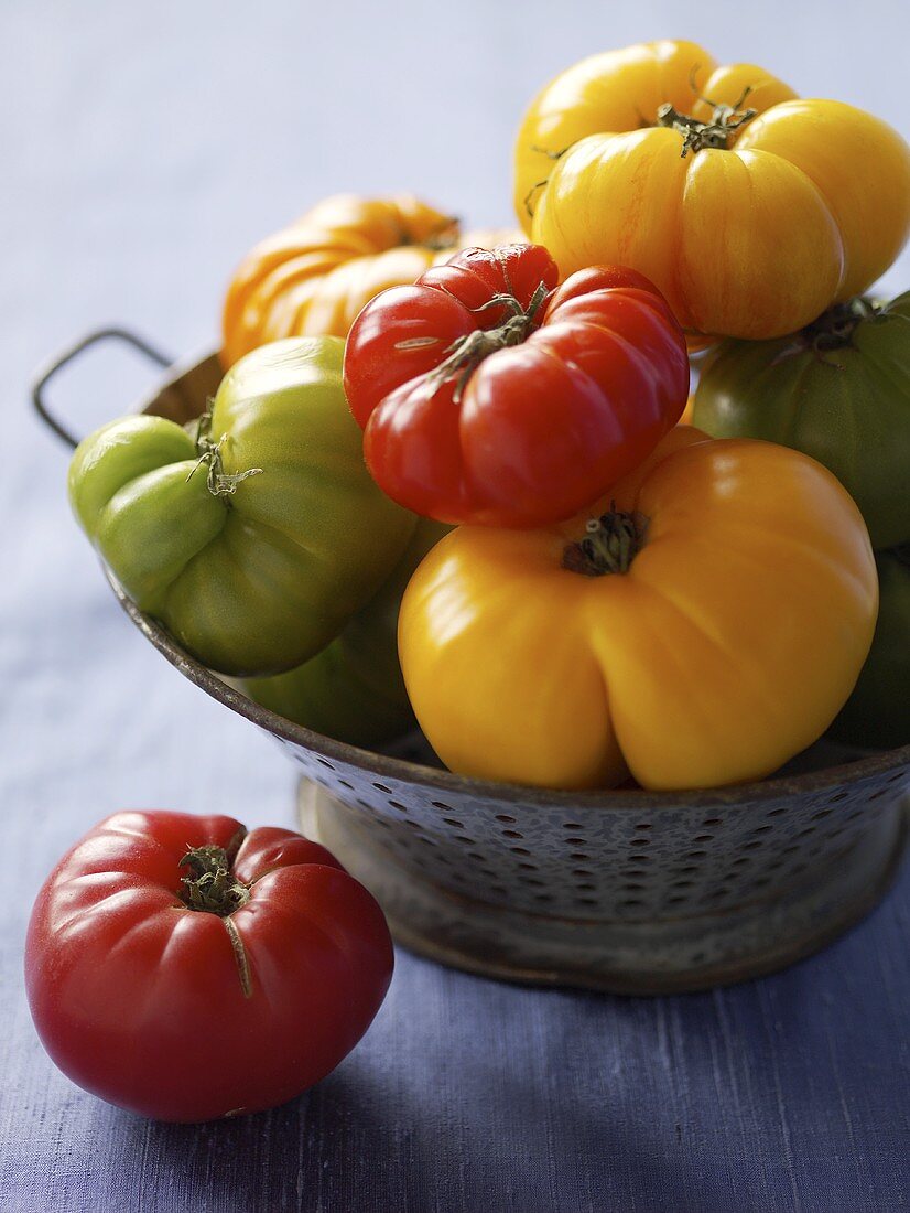 Various Heirloom Tomatoes in a Colander