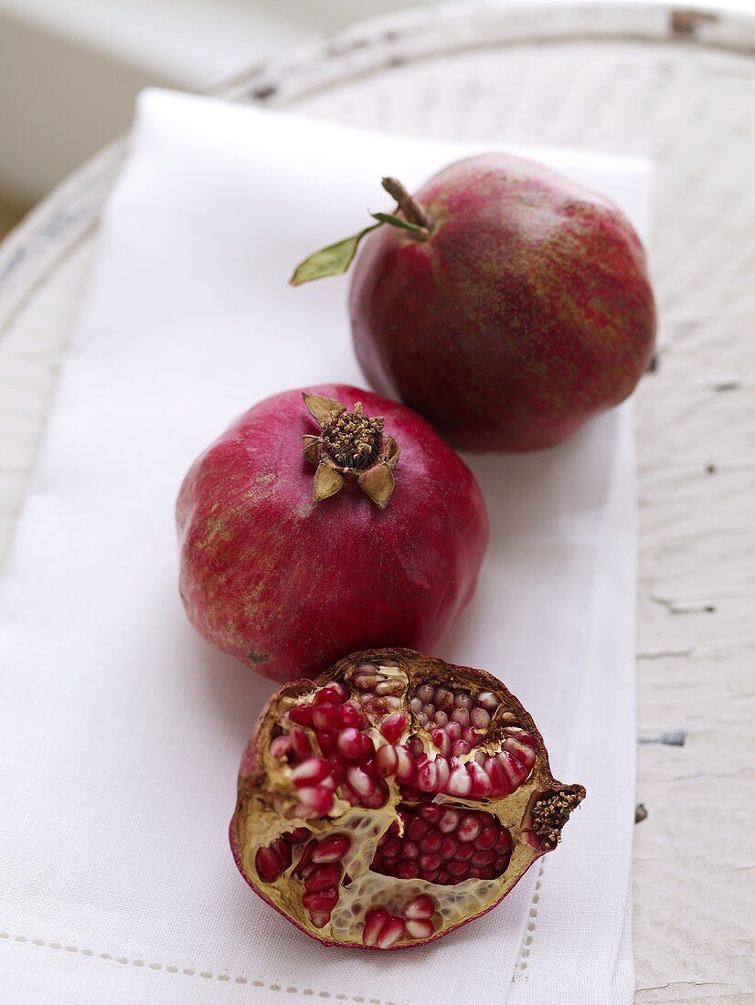 Half a Pomegranate; Two Whole Pomegranates