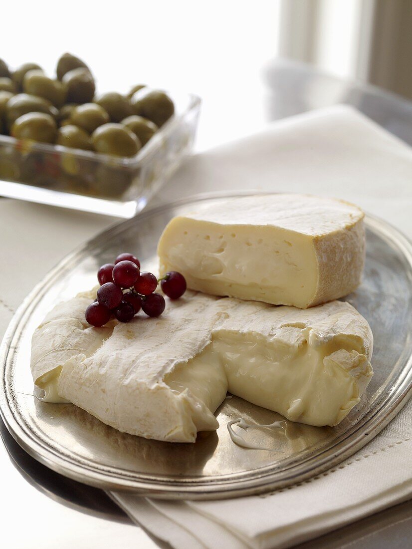 Brie Cheese on Silver Tray with Red Grapes