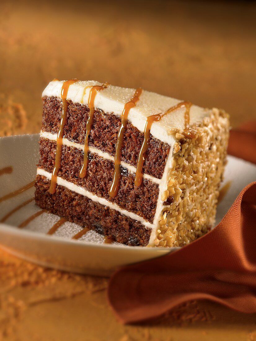 Slice of carrot cake with caramel sauce