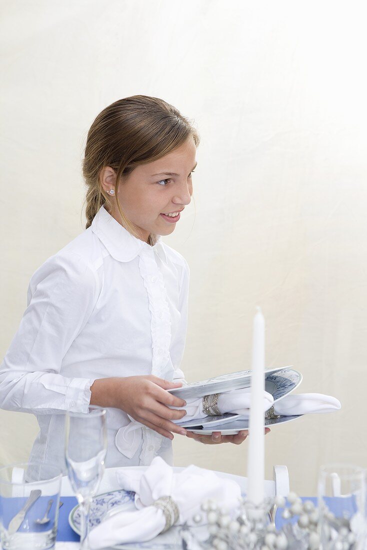 Girl Setting Chanukah Table