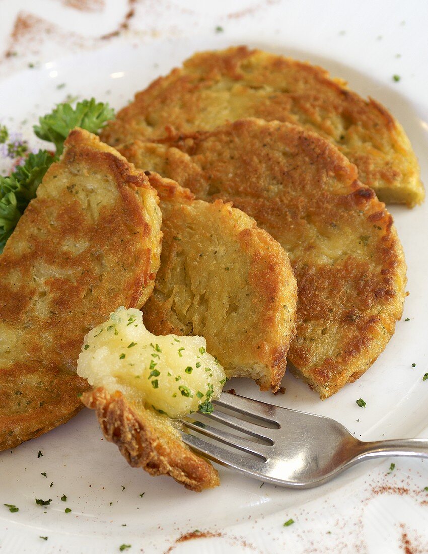 Fried Potato Cakes with Applesauce; On Fork