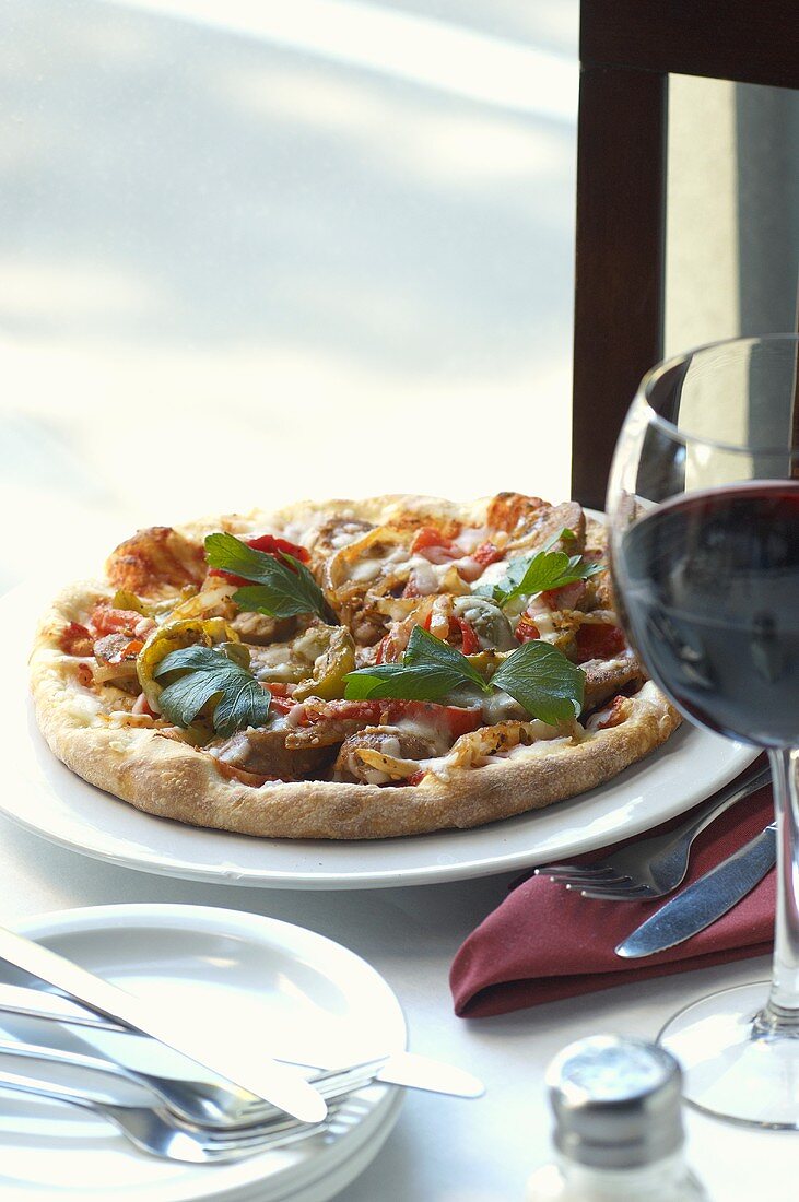 Individual Pizza with Italian Sausage; Wine