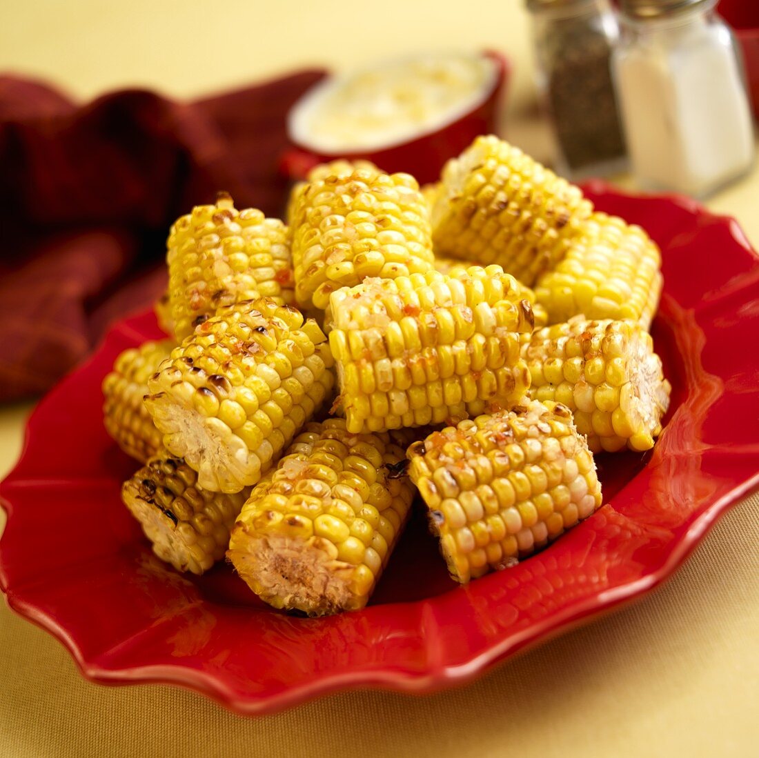 Grilled Corn on the Cob on Red Plate